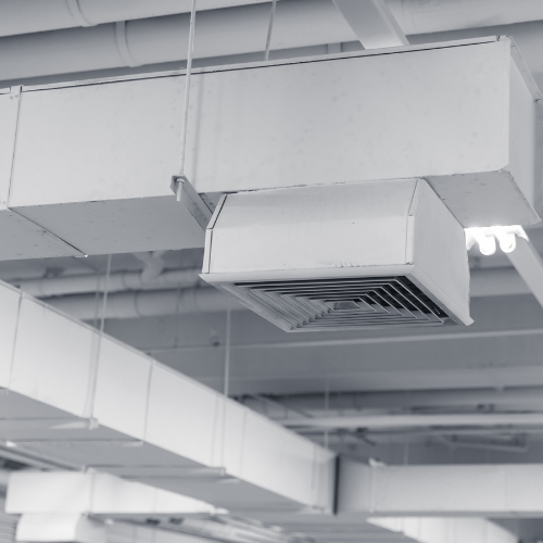 Industrial ducts affixed to a ceiling